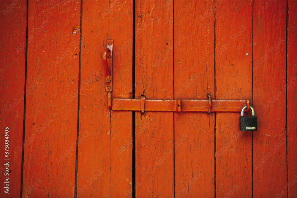Red beautiful textured wooden old gates. Old wooden textured big doors. Red beautiful textured wooden old gates. Old wooden textured big doors.