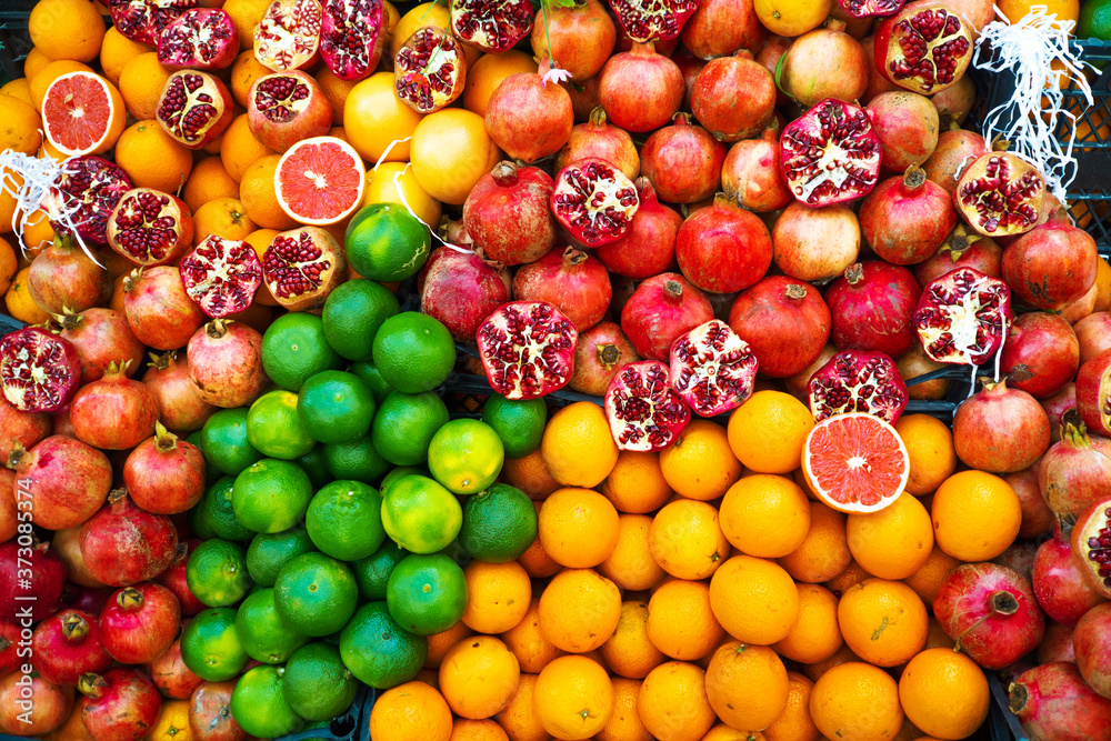Oranges, grapefruits and pomegranates, a fruit counter.