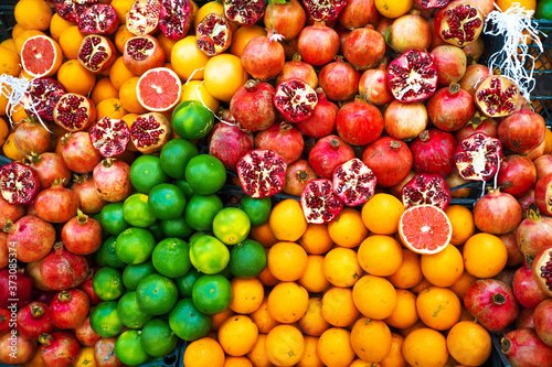 Oranges  grapefruits and pomegranates  a fruit counter.