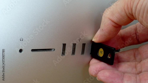 Security hardware key for authentication insert USB port photo