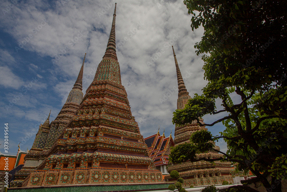 The beautifully decorated pagodas of Wat Pho Bangkok, Thailand. Traditional religious architecture of Asia.