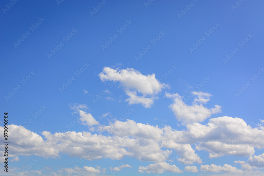 Blue sky with floating white clouds. The background. Blue sky with floating white clouds. The background.
