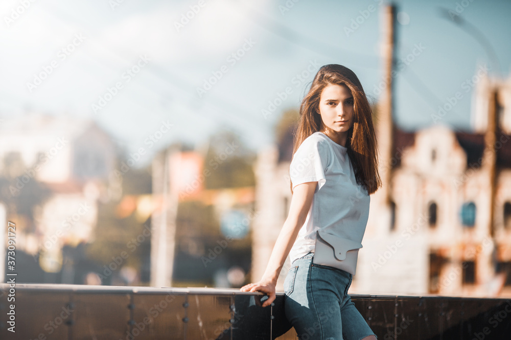 Fototapeta premium Beautiful tourist girl on city street. Gorgeous young model