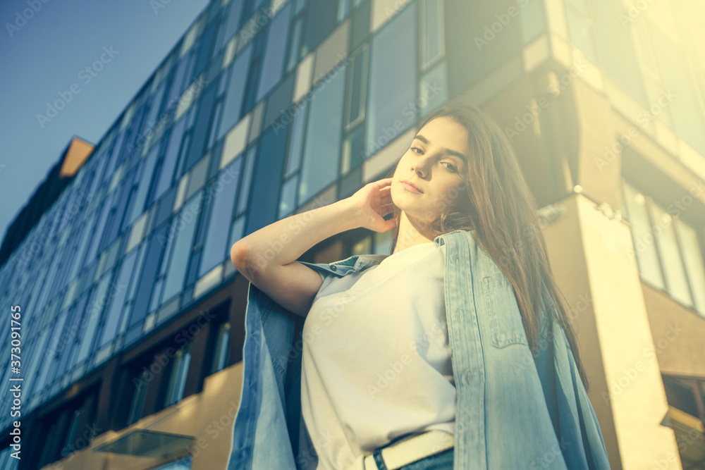 Fototapeta premium Beautiful tourist girl on city street. Gorgeous young model