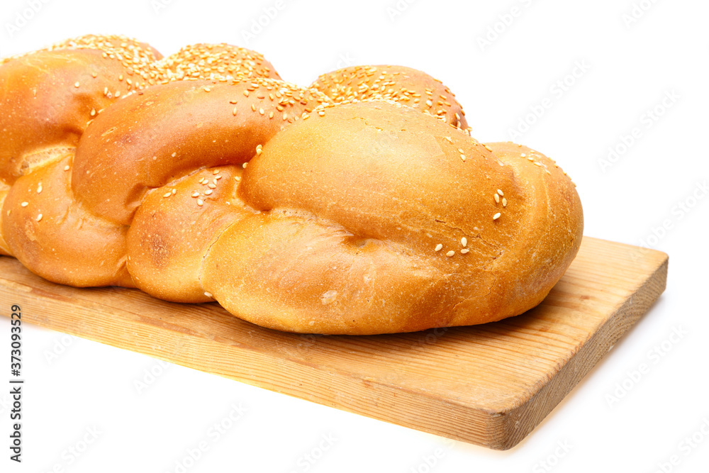 Braided shabbat challah on wooden desk Braided shabbat challah on wooden desk