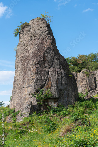 Rock pillar in front of a rock wall at Stenzelberg.