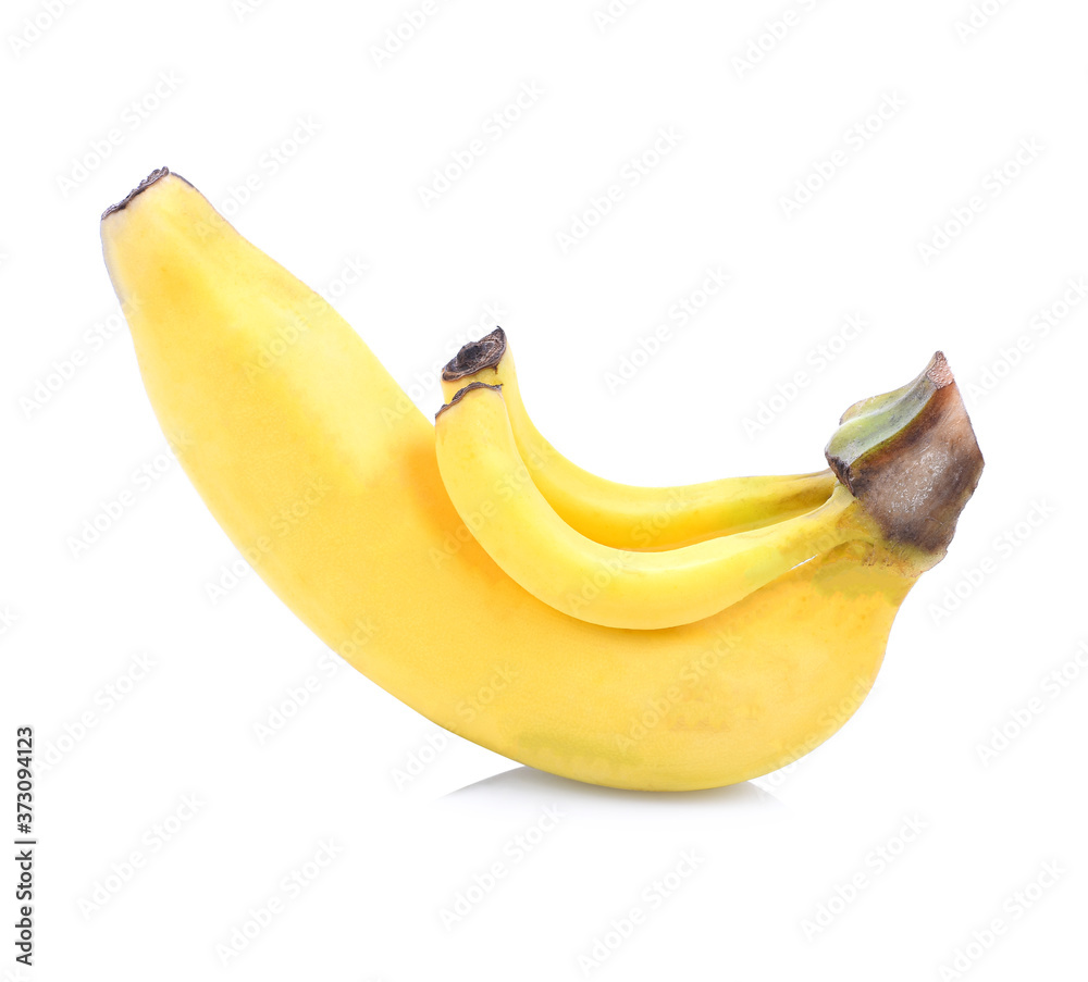 A banch of bananas and a sliced banana in a pot over a table A banch of bananas and a sliced banana in a pot over a table