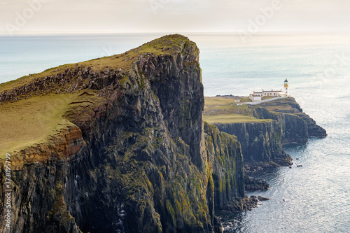 Neist Point cliff, a famous landmark with a lighthouse near Glendale, Isle of Skye, Scotland, United Kingdom.