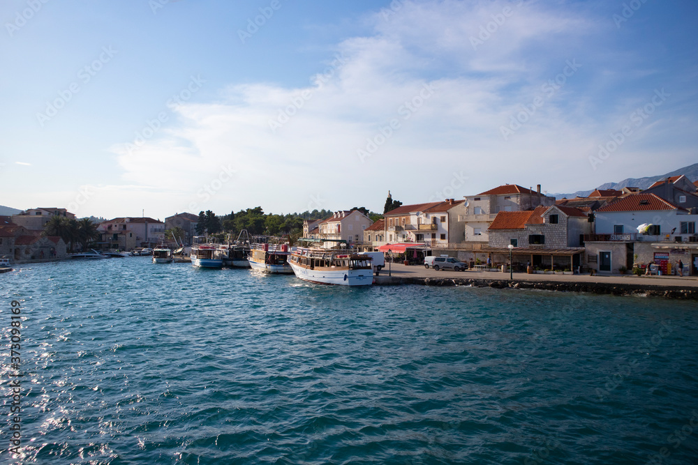 Sucuraj/Croatia-August 3rd,2020: Small town of Sucuraj on the south side of Hvar island, photographed from ferry boat arriving to the port