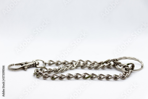 metal chain coiled on white background