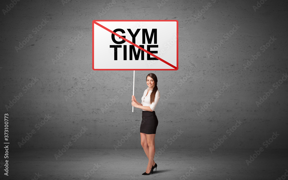 business person holding a traffic sign with GYM TIME inscription, new idea concept business person holding a traffic sign with GYM TIME inscription, new idea concept
