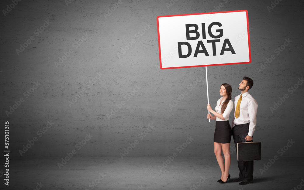 business person holding a traffic sign with BIG DATA inscription, new idea concept business person holding a traffic sign with BIG DATA inscription, new idea concept