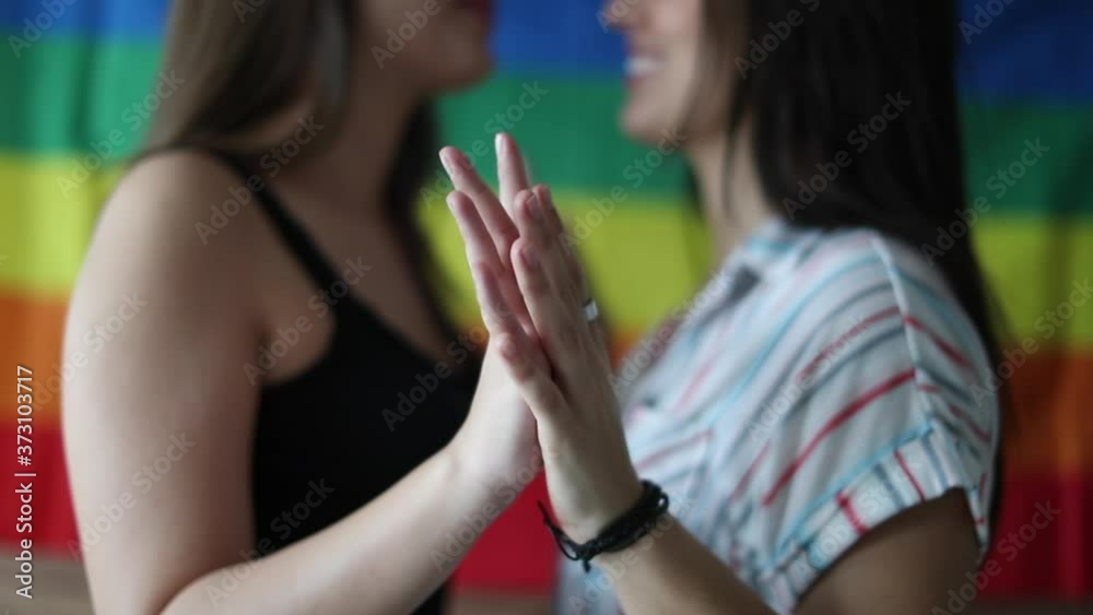 Happy lesbian couple together holding hands, LGBT bonding
