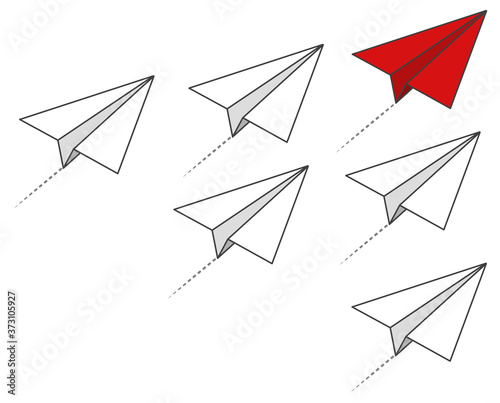 Roter Papierflieger hebt sich von den anderen ab