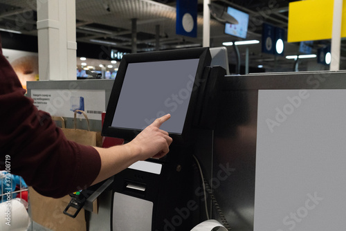 Self service checkout in supermarket photo