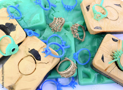 Silica rubber molds, silver molds, many green and blue wax rings, used in the manufacture of jewelry in the jewelry industry.