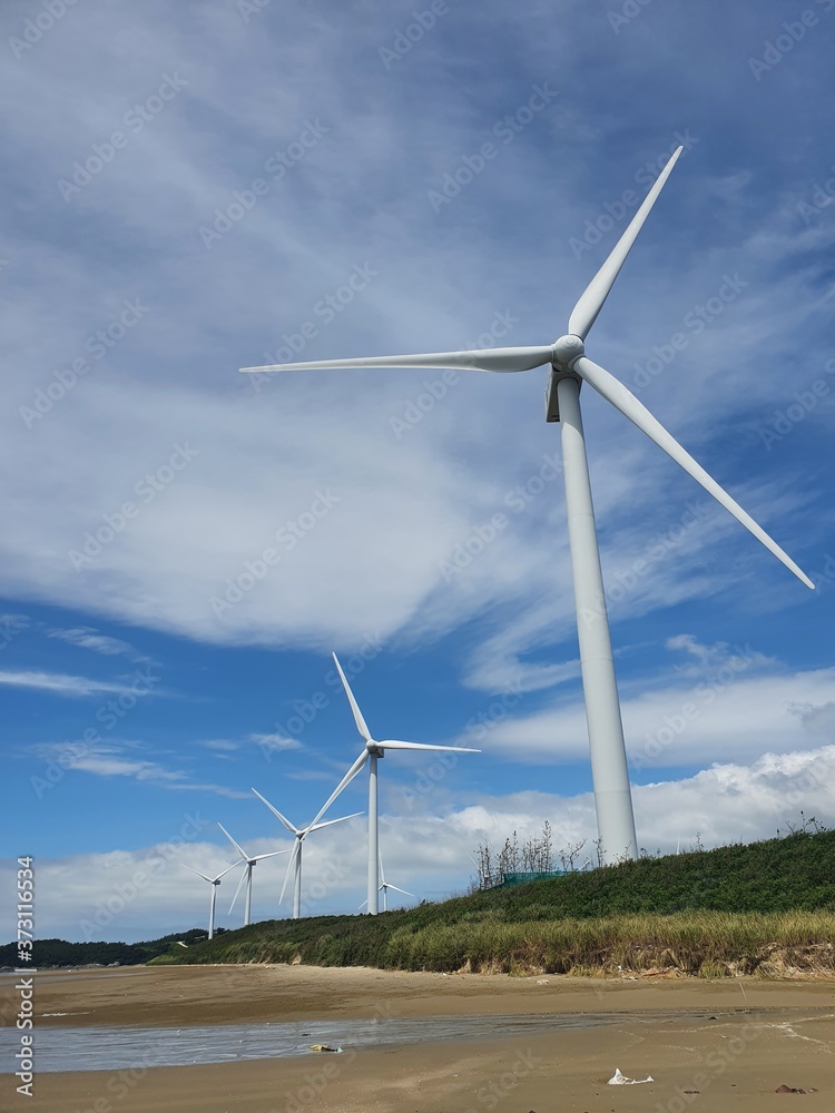 Sinan-gun, Jeollanam-do, South Korea - 26th July 2020 : Scenery of Egi Beach and wind power generator in Sinan-gun Island Sinan-gun, Jeollanam-do, South Korea - 26th July 2020 : Scenery of Egi Beach and wind power generator in Sinan-gun Island