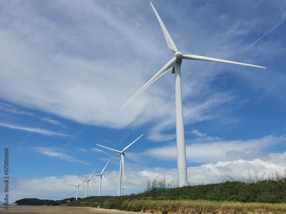 Sinan-gun, Jeollanam-do, South Korea - 26th July 2020 : Scenery of Egi Beach and wind power generator in Sinan-gun Island Sinan-gun, Jeollanam-do, South Korea - 26th July 2020 : Scenery of Egi Beach and wind power generator in Sinan-gun Island