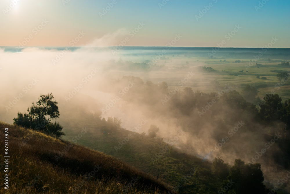 Sunrise over the cliff.
Morning haze at dawn on a cliff in summer.
freshness