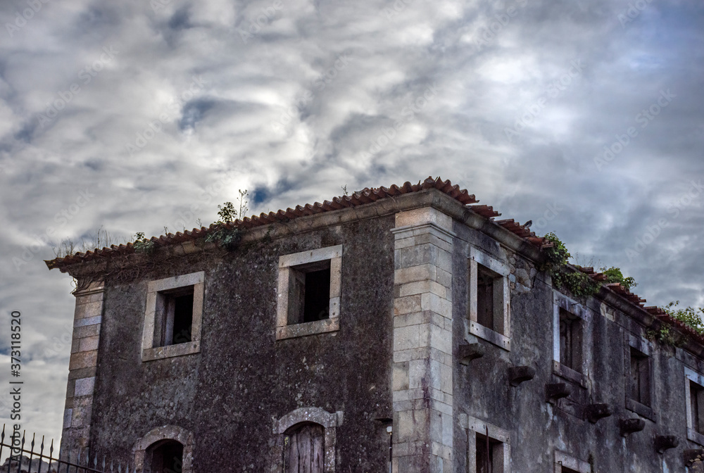 Multi-Windowed Abandoned Stone Monastery With Ominous Clouds, Braga, Portugal