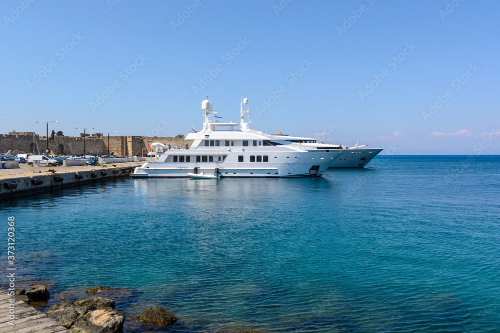 Luxury yachts mooring at the port of Rhodes in Greece