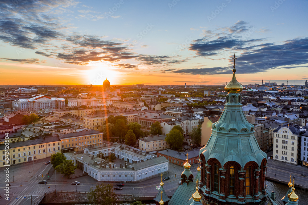 The Uspenski Cathedral, St Nicholas' Church, beautiful sunset on the background, Helsinki, Finland.