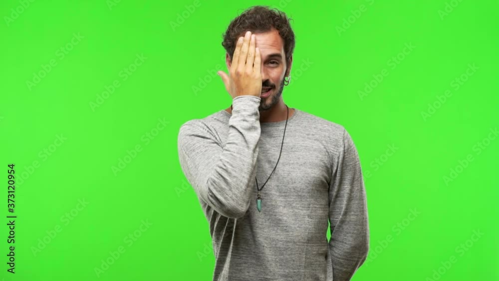 young man on chroma green screen shouting and enjoying young man on chroma green screen shouting and enjoying