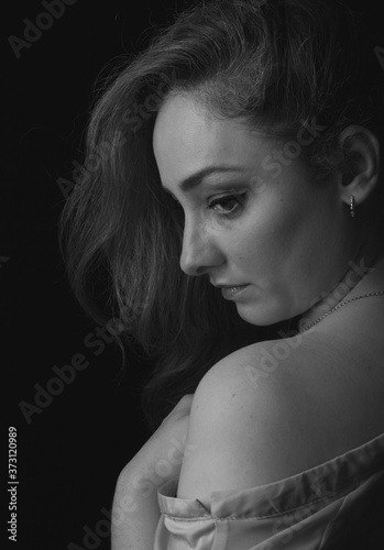 Portrait of a sensual woman in dark monochrome