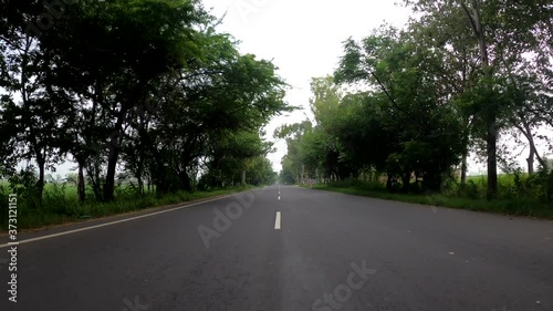 road fast moving center view with traffic passing by