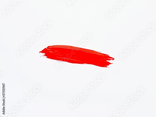 A smear of red paint on a white background. A place for text.