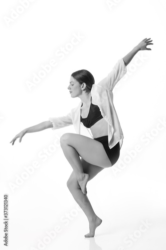  Young beautiful dancer posing on a studio background. Black and white. Isolated © liliportfolio