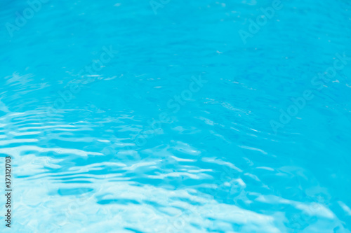 Water waves in the pool with blue background