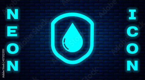 Glowing neon Waterproof icon isolated on brick wall background. Water resistant or liquid protection concept. Vector Illustration.