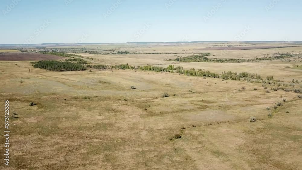 panorama in motion view of the beveled farm fields in late summer. panorama in motion view of the beveled farm fields in late summer.