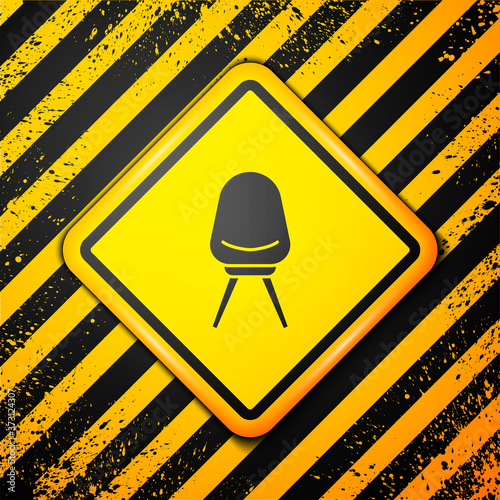 Black Office chair icon isolated on yellow background. Warning sign. Vector Illustration.