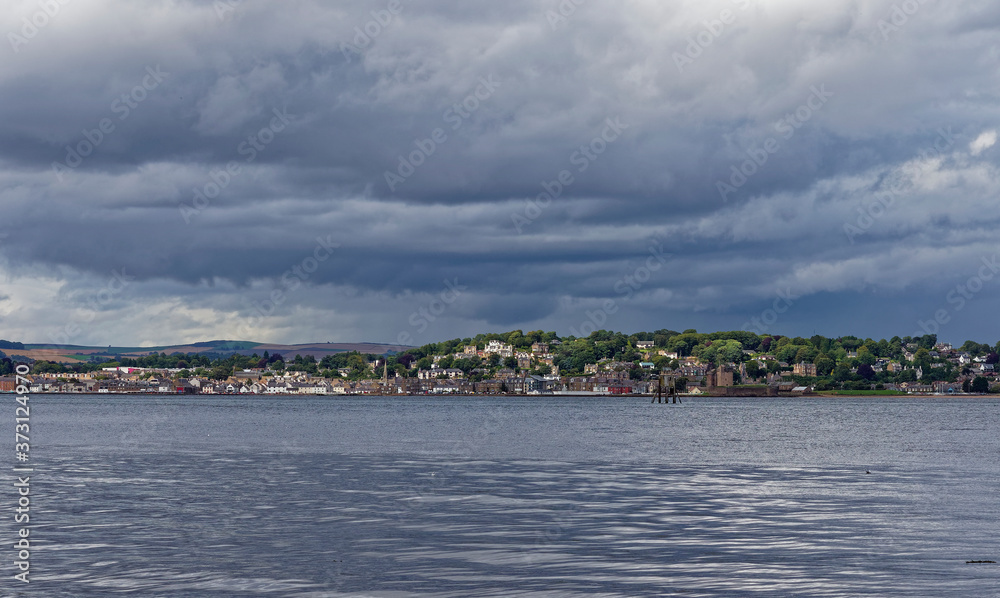 Fototapeta premium Looking across the Tay Estuary from Tayport towards Broughty Ferry to the North, with the Old Tayport Pile Lighthouse in the foreground.
