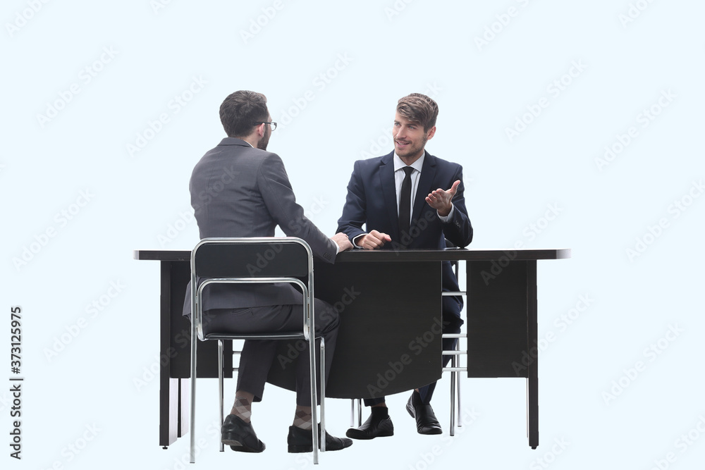 two business people talking sitting at a Desk two business people talking sitting at a Desk