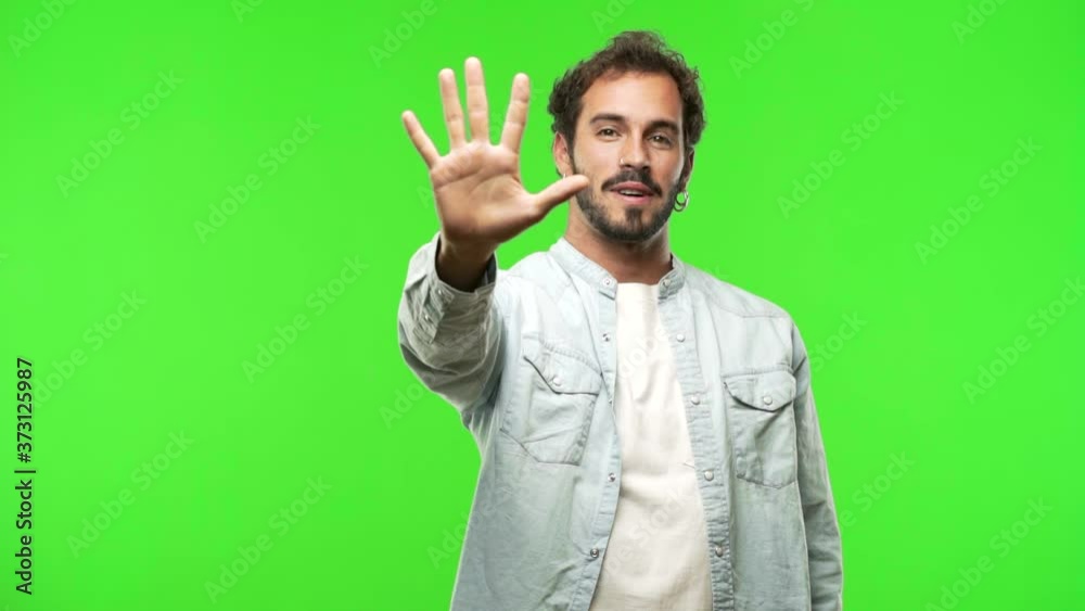young man on chroma green screen showing number nine young man on chroma green screen showing number nine