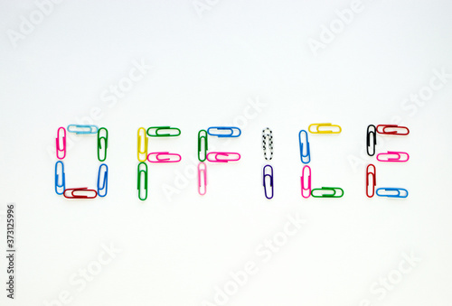 Made up of multicolored paper clips word office on white background