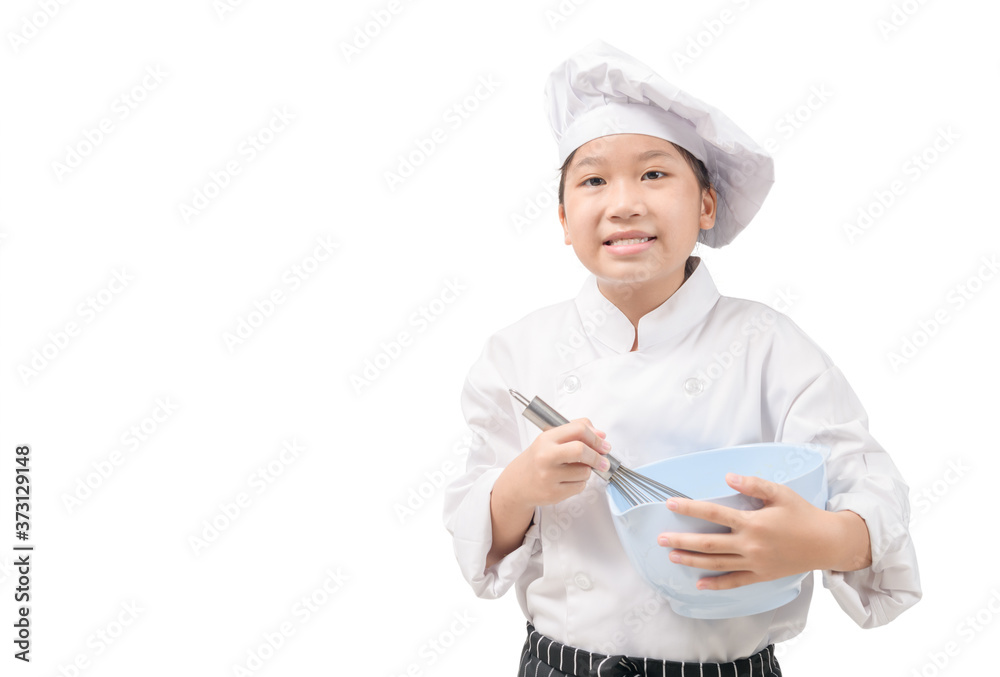 Little chef in uniform holds an egg whisk and a plastic bowl Little chef in uniform holds an egg whisk and a plastic bowl