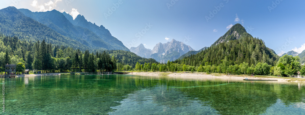 Stunning panorama view over Lake Jasna, Kranjska Gora, Slovenia, with the Alps in the background