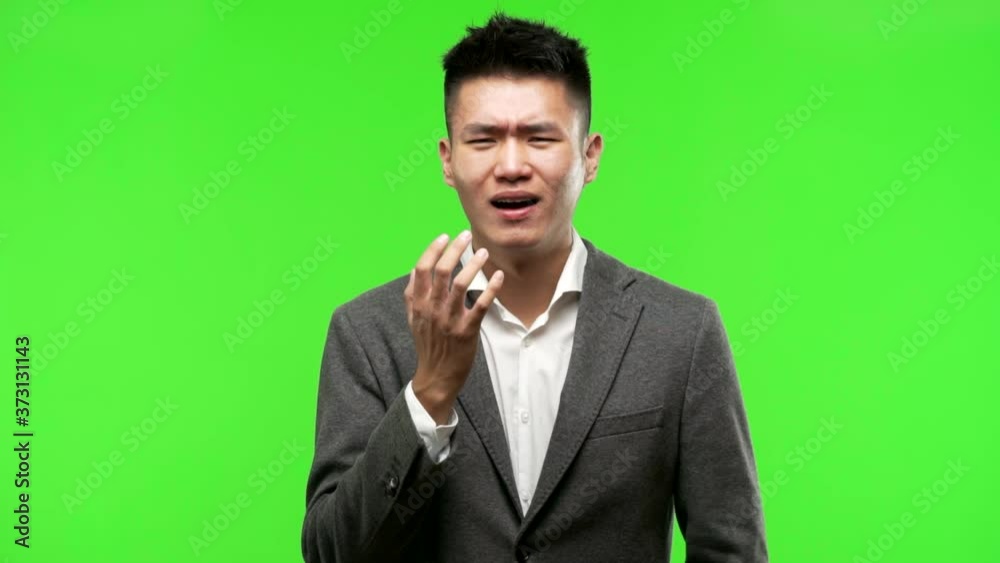 Young chinese business man very scared and afraid Young chinese business man very scared and afraid