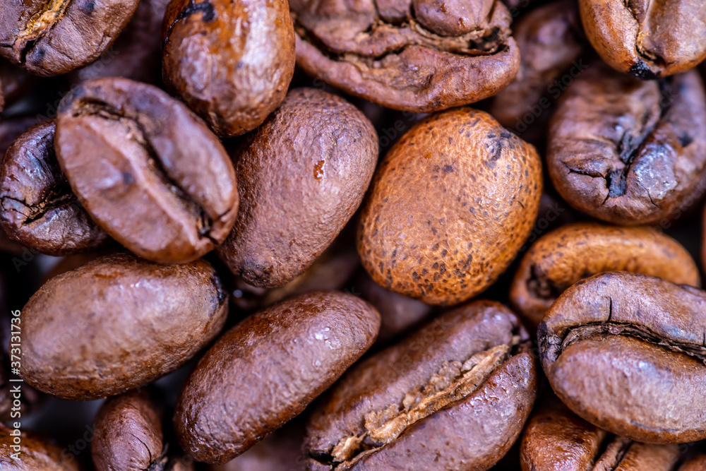 Macro shot of whole bean organic smooth medium dark roast coffee Macro shot of whole bean organic smooth medium dark roast coffee