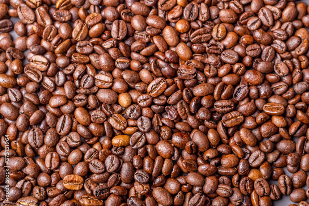 Macro shot of whole bean organic smooth medium dark roast coffee