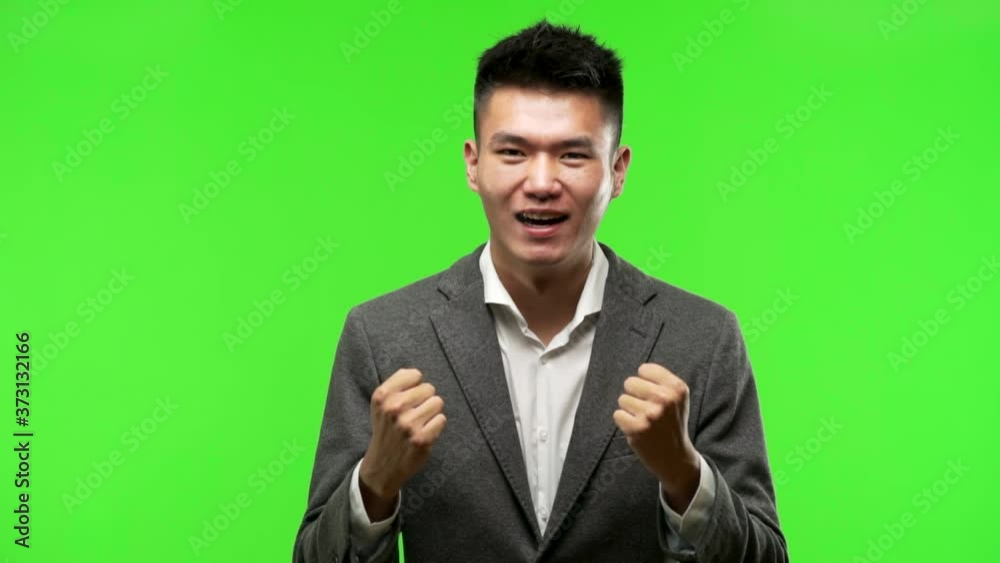 Young chinese business man surprised and shocked Young chinese business man surprised and shocked