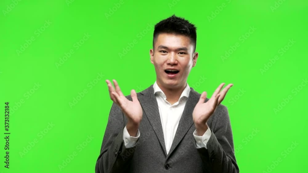 Young chinese business man celebrating a victory or success Young chinese business man celebrating a victory or success