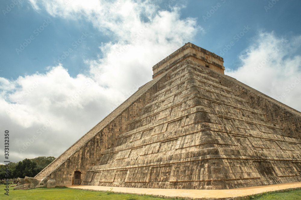 Impressive ancient Mayan temple. This wonder of the world is symbol and place of worship for the deity Kukulkan. The feathered serpent. Impressive ancient Mayan temple. This wonder of the world is symbol and place of worship for the deity Kukulkan. The feathered serpent.