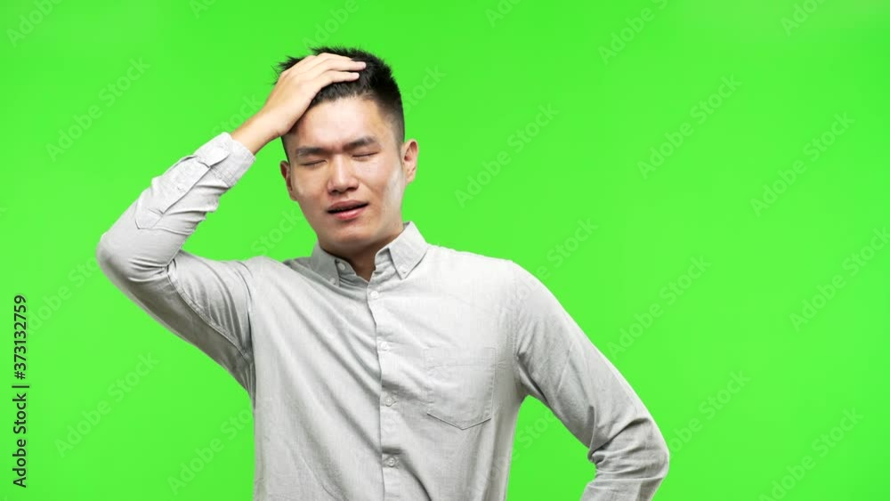 Young handsome chinese man worried and overwhelmed Young handsome chinese man worried and overwhelmed
