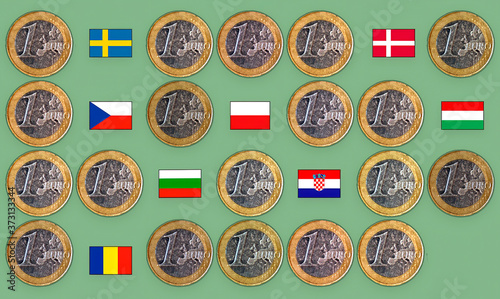 Euro coins with the 28 countries that make up the European Union, with the flags of the countries that have not adopted the euro. Concept of union, direction, Europe.