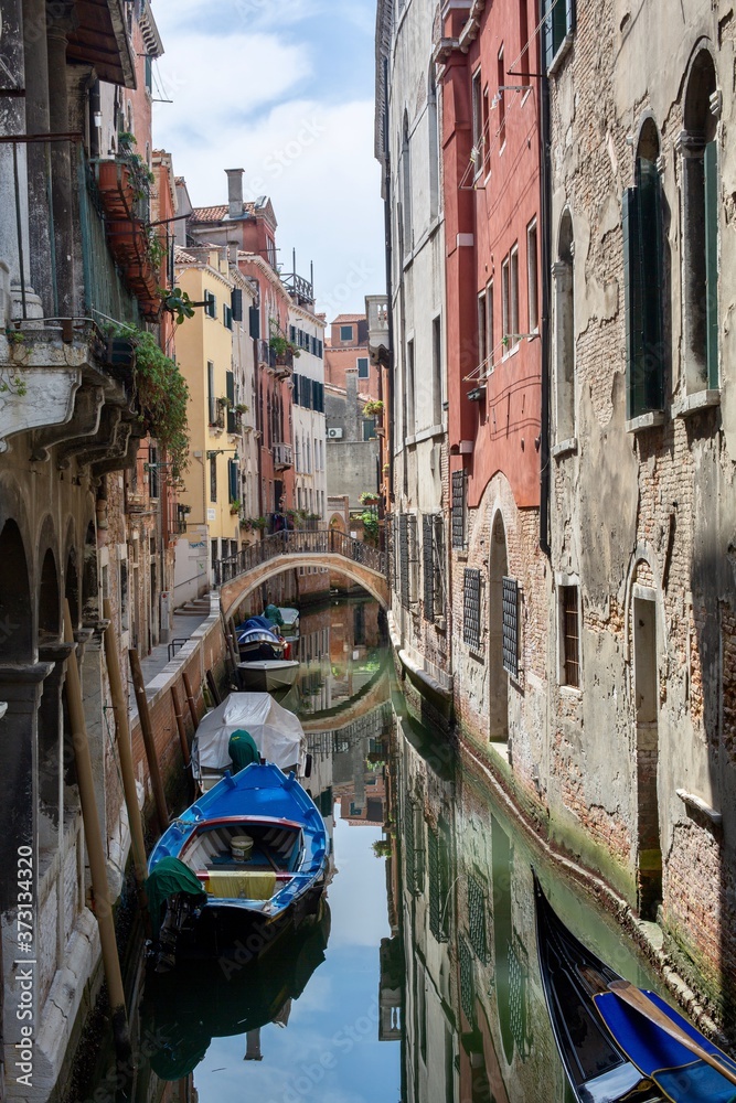The narrow canal of Venice. Italy. Street, canal, old buildings of Venice.